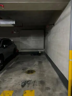 a parking garage with a car parked in it at Comfort apt in Magdalena front of supermarket! in Lima