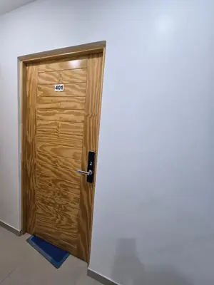 a wooden door with the number on it at 402 Moderno departamento equipado in Abancay