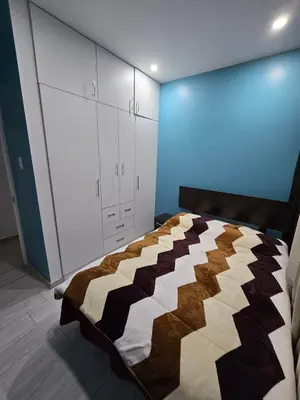 a bedroom with a large bed with a brown at 402 Moderno departamento equipado in Abancay