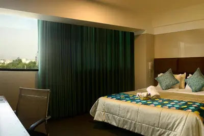 a bedroom with a bed with a teddy bear on it at Hotel Lima City in Lima