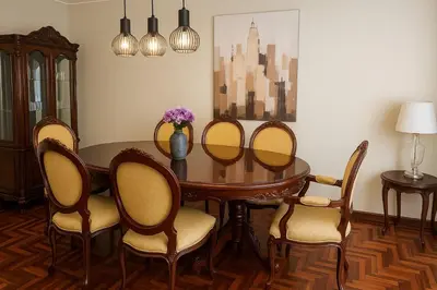 a dining room with a wooden table and chairs at Bello departamento en el corazón de Miraflores in Lima