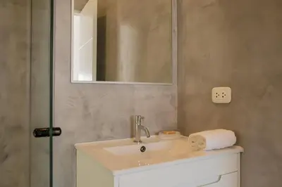 a bathroom with a sink and a mirror at Casa la Paz by Wynwood House in Lima