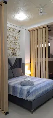 a bedroom with a large bed in a room at ideal depa lujo con cocina wifi in Puente Piedra