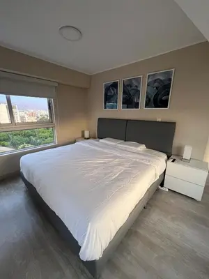 a bedroom with a large white bed and two windows at Premium apartment with AC Miraflores in Lima