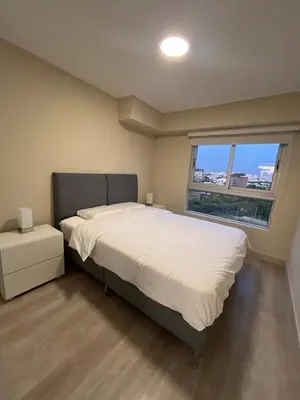 a bedroom with a large bed and a window at Premium apartment with AC Miraflores in Lima