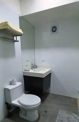 a bathroom with a white toilet and a sink at Apartment in Miraflores - Lima in Lima