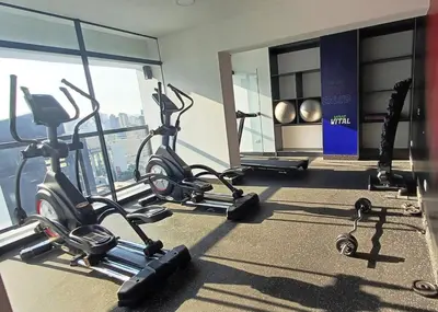 a gym with treadmills and exercise bikes in a building at Apartment in Miraflores - Lima in Lima