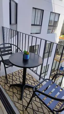 a table and two chairs on a balcony at Miraflores Deluxe in Lima