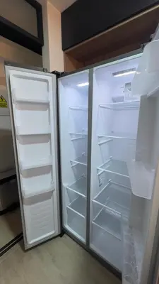 an empty refrigerator with its door open in a kitchen at Miraflores Deluxe in Lima