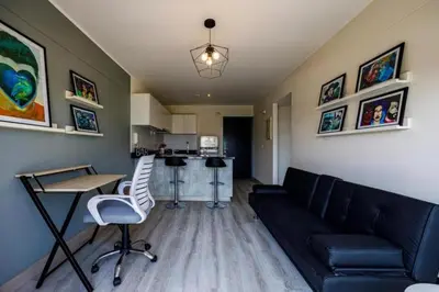 a living room with a couch and a table at BR1 Barranco Exclusive Department in Lima