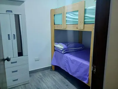a bunk bed in a room with a purple bed at Apartamento 3D de estreno muy céntrico in Lima