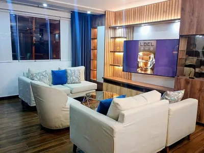 a living room with two couches and a tv at Apartamento 3D de estreno muy céntrico in Lima
