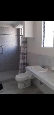a bathroom with a toilet and a sink at Noah'house in Nazca