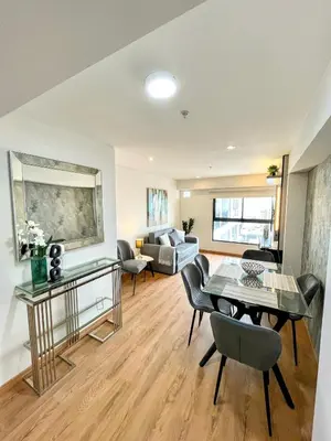 a living room with a table and chairs at Ocean view 1 BR Miraflores with parking in Lima