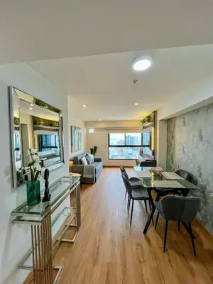 a living room with a table and chairs and a couch at Ocean view 1 BR Miraflores with parking in Lima