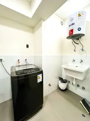 a bathroom with a sink and a water dispenser at Ocean view 1 BR Miraflores with parking in Lima