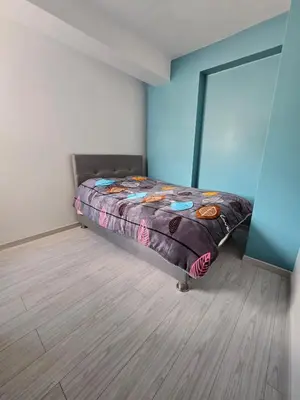 a bedroom with a bed with a quilt on it at 501 Modern equipped department 3 in Abancay