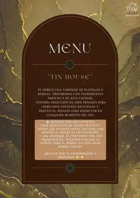 a sign for a menu tin house on a table at El Encanto Espacio Calido A warm space in Los Olivos in Lima