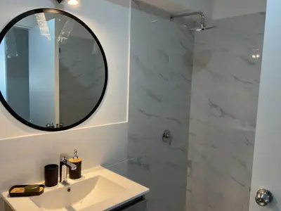 a bathroom with a sink and a mirror at Apartament Qosco in Cusco