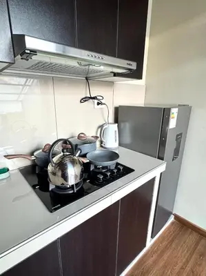 a kitchen with a stove with pots and pans on it at Casa Cusco in Cusco