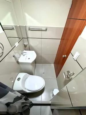 a bathroom with a toilet and a sink at Casa Cusco in Cusco