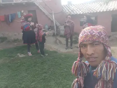 a group of people standing in front of a house at Casa de Gumercindo in Ccorcor