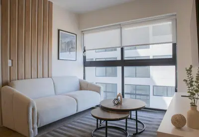 a living room with a couch and a table at Salaverry by Wynwood House in Lima