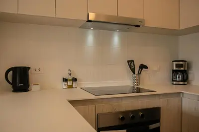 a kitchen with a sink and a stove top oven at Salaverry by Wynwood House in Lima