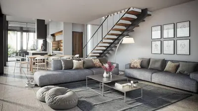 a living room with a couch and a staircase at Magnum House in Huancayo