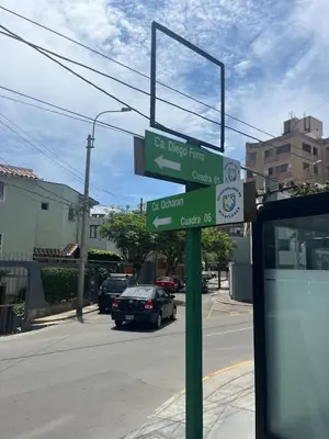 two green street signs on a pole on a street at Casita de Miraflores calle Ocharan a 5 minutos de Larcomar in Lima