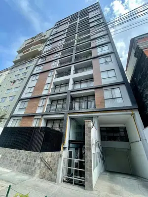 a tall building with a lot of windows at Céntrico departamento in Lima