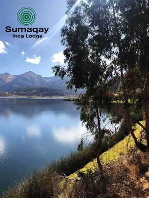 a view of a lake with mountains in the background at Sumaqay Lodge -Naturaleza Arte y Arquitectura
