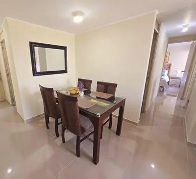 a dining room with a wooden table and chairs at Apartamento Premium frente a Universidad San Marcos para 4 pers en lima in Lima