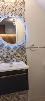 a bathroom with a sink and a mirror at Munay hospedaje in Cusco