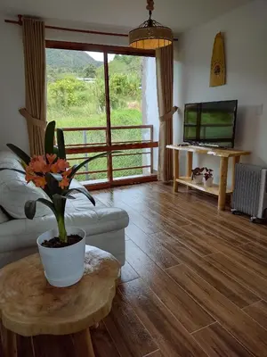 a living room with a couch and a table at Sweet Home Oxapampa in Oxapampa