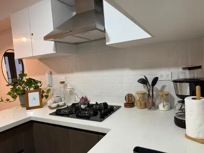 a kitchen with a stove and a white counter top at Art08 Milu - Miraflores Cerca de Larcomar in Lima