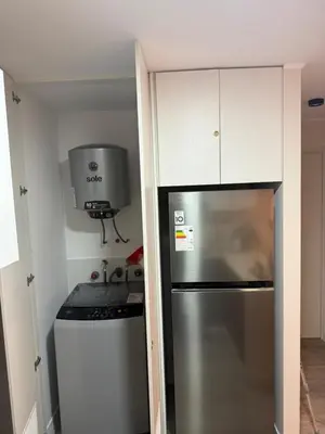 a kitchen with a stainless steel refrigerator and a stove at Art08 Milu - Miraflores Cerca de Larcomar in Lima