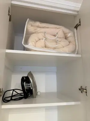 a bed in a cabinet with a phone in it at Art08 Milu - Miraflores Cerca de Larcomar in Lima