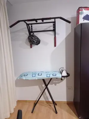 a room with a shelf on the wall at Apartment 12 min from airport in Lima