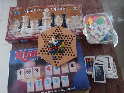 a chess game on a table next to a box at Apartment 12 min from airport in Lima