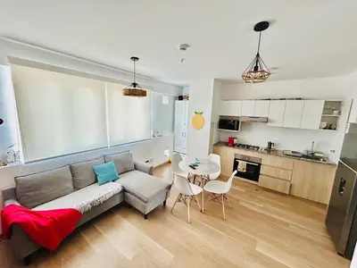 a living room with a couch and a table at departamento nuevo con espectacular vista entre surco y Miraflores in Lima