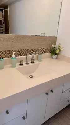 a bathroom counter with a sink and a mirror at Apartment in front of the Ricardo Palma Clinic in Lima