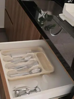 a tray of utensils sitting in a drawer at Craviz house ,a home away from home in Lima