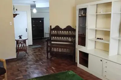 a living room with white shelves and a wooden floor at La casona cusco in Cusco