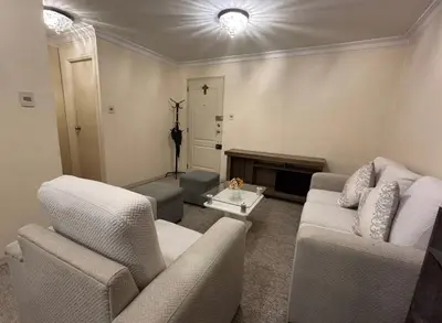 a living room with a couch and chairs and a fireplace at Apartment in cusco center in Cusco