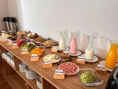 a table with many different types of food on it at Hotel Litan Machu Picchu in Machu Picchu