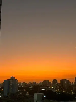 a view of a city skyline at sunset at Apartamento en Santa Beatriz in Lima