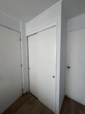 two doors in a room with white walls at Apartamento en Santa Beatriz in Lima