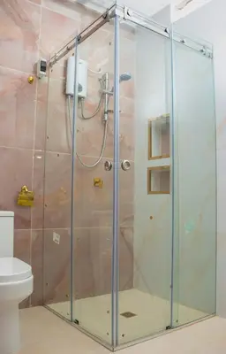 a shower with a glass door in a bathroom at Luxurious Apt with Rooftop, BBQ, and Beach nearby in Punta Hermosa
