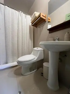 a bathroom with a toilet and a sink at Casa Terra Cusco in Cusco